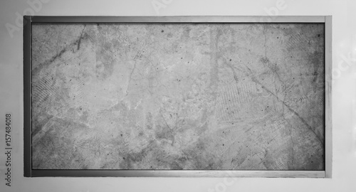 Concrete with stainless frame on white wall background