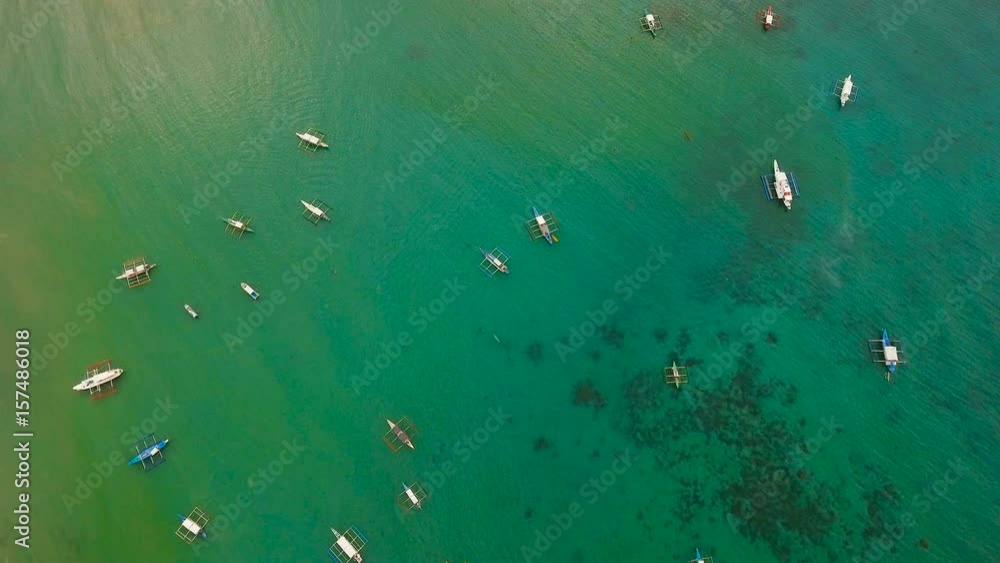 Aerial view of sailing boats and yachts in the bay. Boat and yacht in the tropical lagoon. Aerial view: tropical landscape. Aerial video tropical island. Philippines, El Nido. 4K video. Travel concept Aerial view of sailing boats and yachts in the bay. Boat and yacht in the tropical lagoon. Aerial view: tropical landscape. Aerial video tropical island. Philippines, El Nido. 4K video. Travel concept