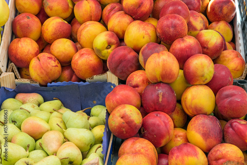 Nectarines and pears for sale at a market
