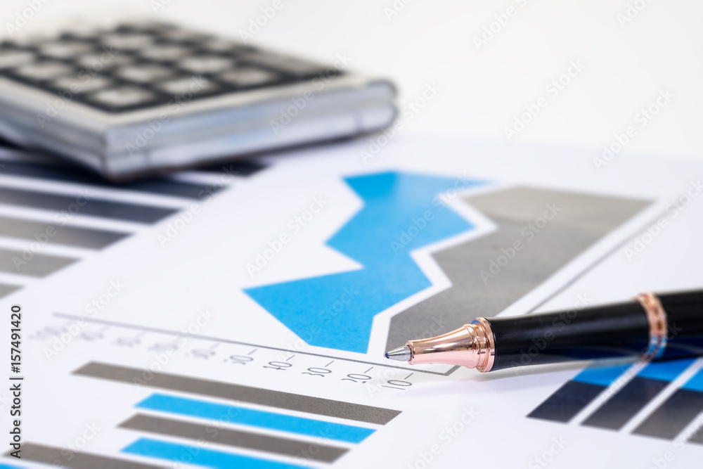 close up ballpen on graph financial paper for finance; accounting; risk; investor; management concept close up ballpen on graph financial paper for finance; accounting; risk; investor; management concept
