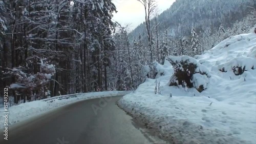 Snowy Drive on a Winding Alpine Road in High Speed Video IV
