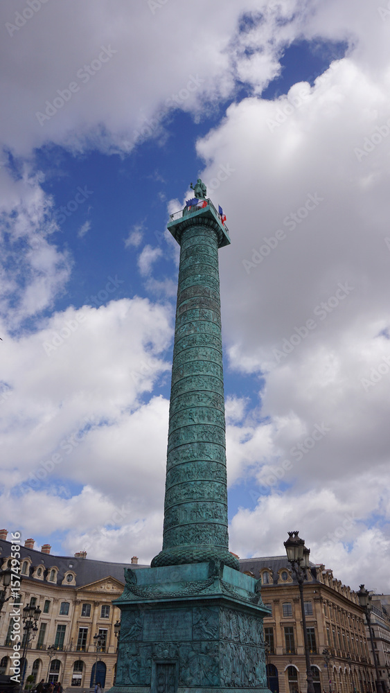 Photo of place Vendome obelisk on a spring cloudy morning, Paris, France