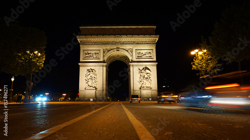 Night photo of iconic Arc de Triomphe in Champs Elysees, Paris, France © aerial-drone