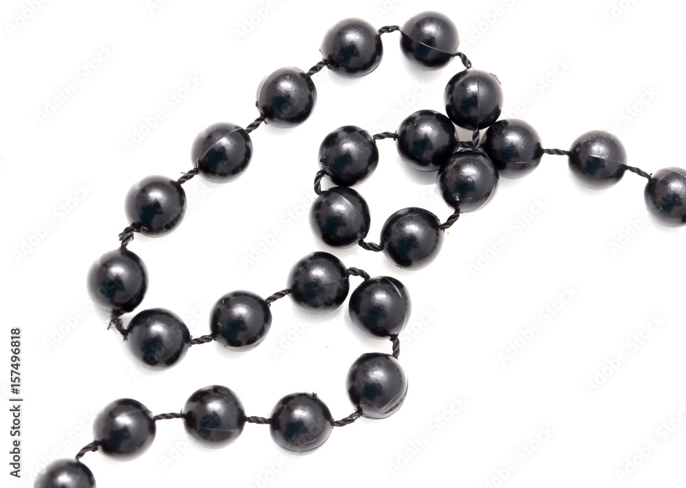 Black beads on a white background Black beads on a white background