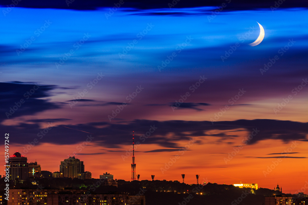 View of the big city silhouette against the backdrop of incredibly, awesome bright, multicolour sunset. Kyiv. Ukraine.