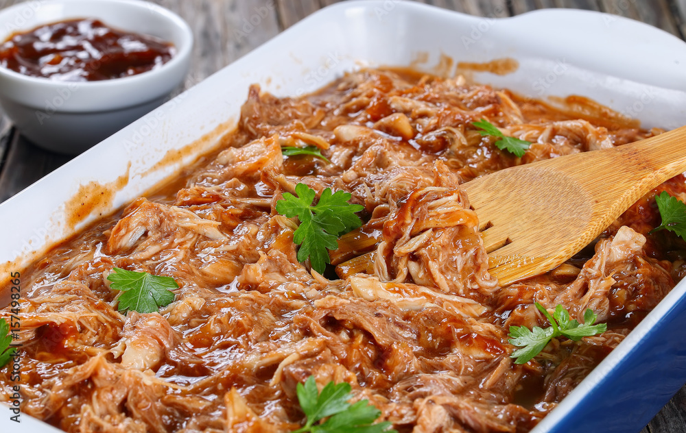 Shredded meat tossed in barbecue sauce Shredded meat tossed in barbecue sauce