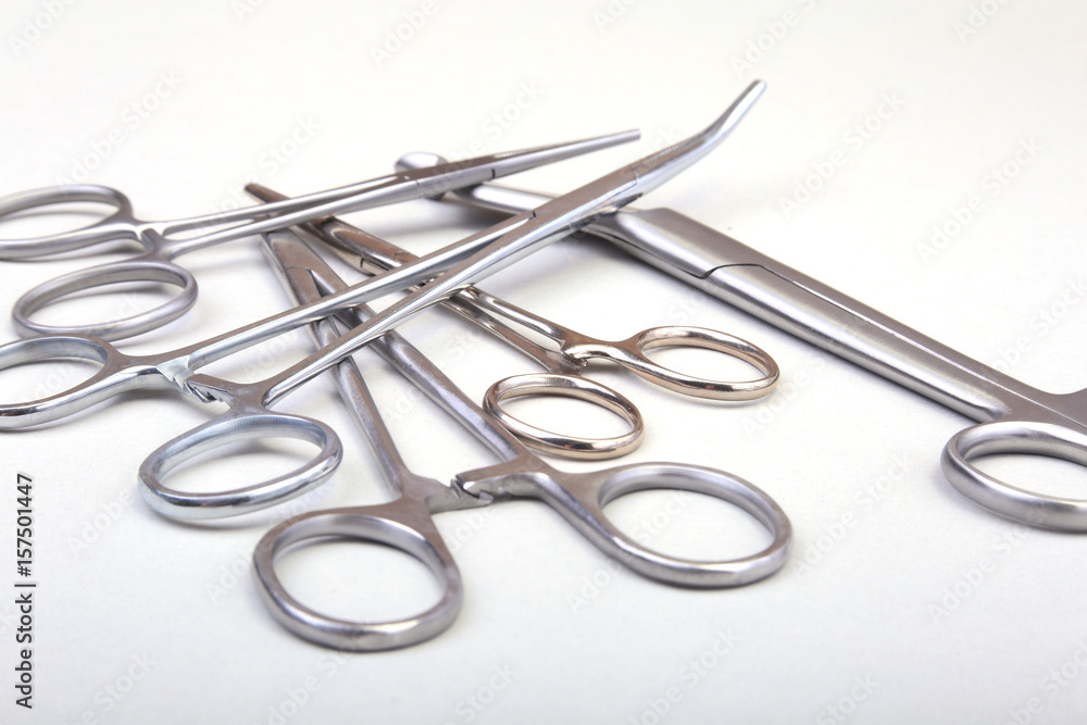 Close Up Surgical instruments and tools on white background. Selective focus. Close Up Surgical instruments and tools on white background. Selective focus.