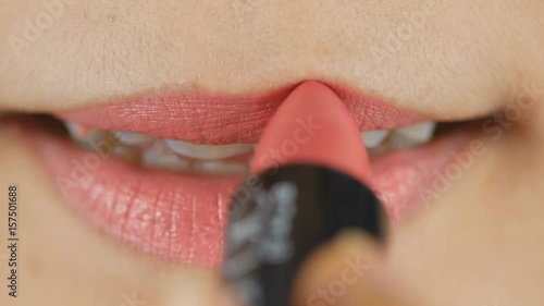 4K Close up of woman applying pink lip