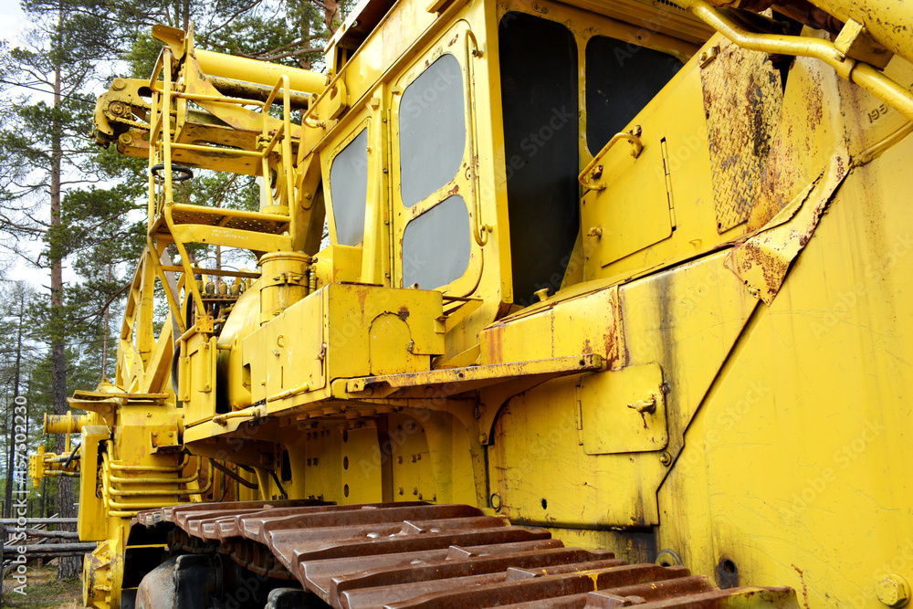 Tractor for laying yellow cables from the left