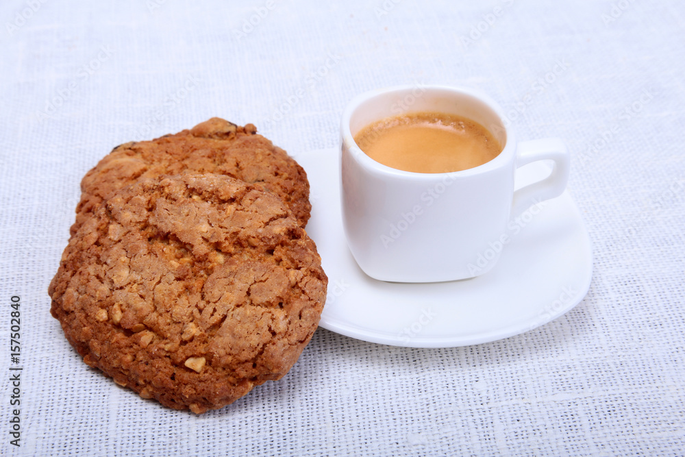 Fresh homemade muffin, cake and white cup of Cappuccino on white background. Fresh homemade muffin, cake and white cup of Cappuccino on white background.