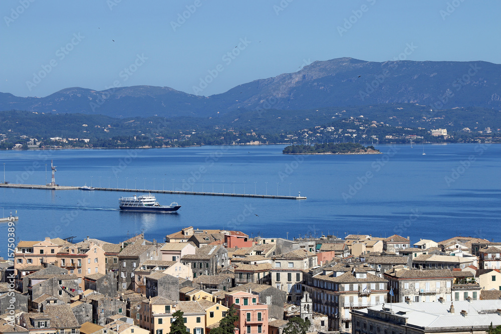 ferry boat sailing near Corfu town Greece summer season