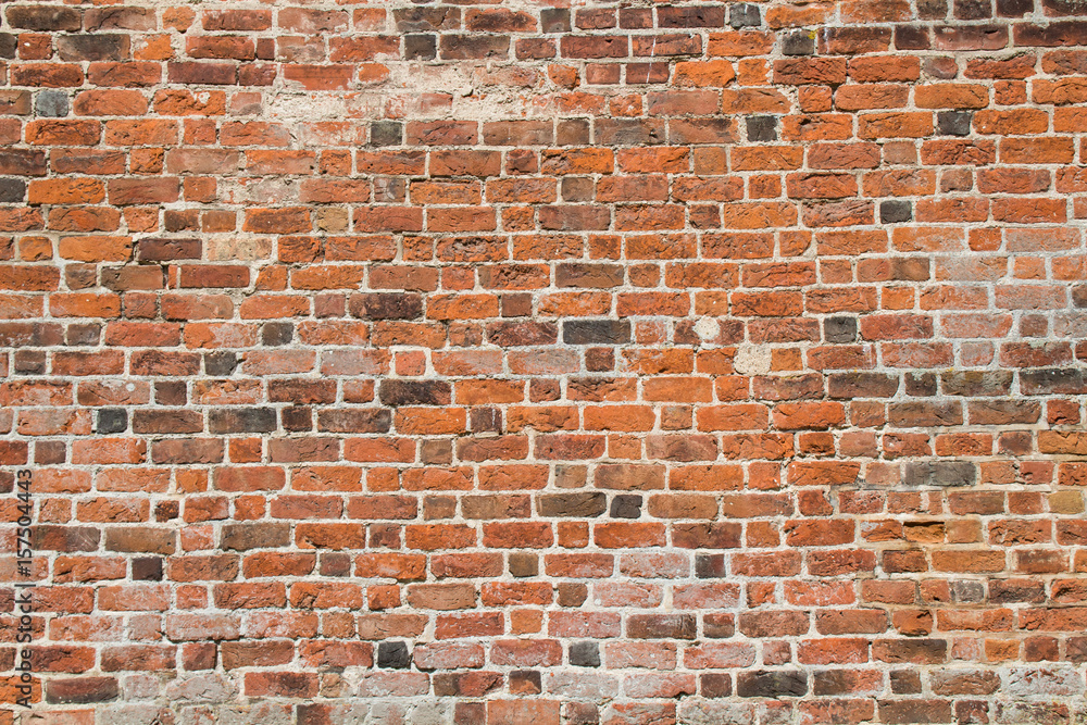 Naklejka premium Red old brick wall - background texture