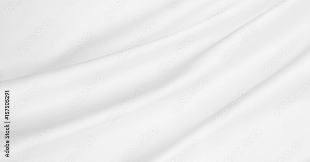 Smooth elegant white silk or satin luxury cloth texture as wedding background. Luxurious background design