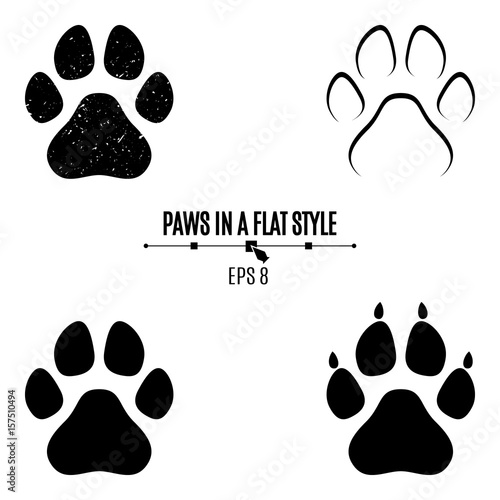 A set of dog's paws. Black traces in different styles. Isolated on white background. Silhouettes of paws