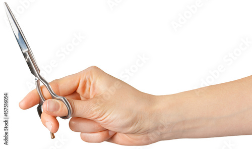 the hand of a Barber holding a scissors