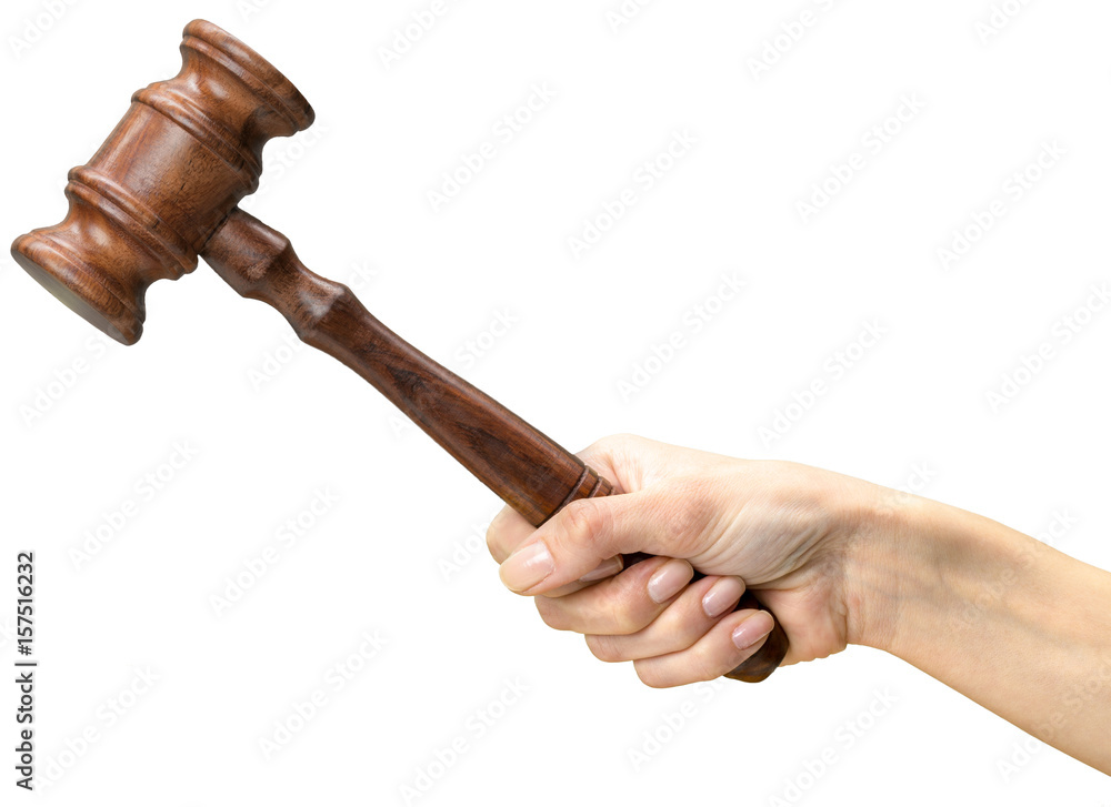 someones hand holding Wooden Law Gavel someones hand holding Wooden Law Gavel