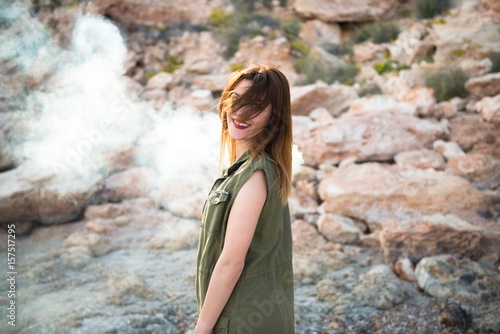 Beautiful girl outdoor with with smoke bomb © luismolinero
