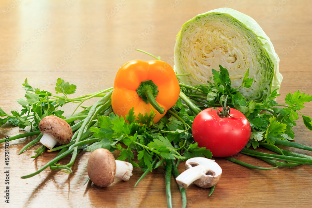 Set of fresh natural products with cabbage, pepper, tomato, mushrooms, onion and parsley Set of fresh natural products with cabbage, pepper, tomato, mushrooms, onion and parsley