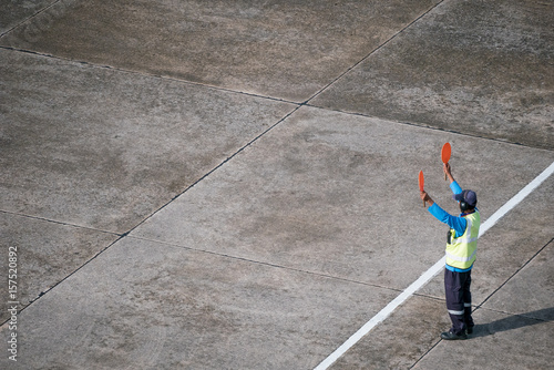 Marshaller signalling to the aircraft