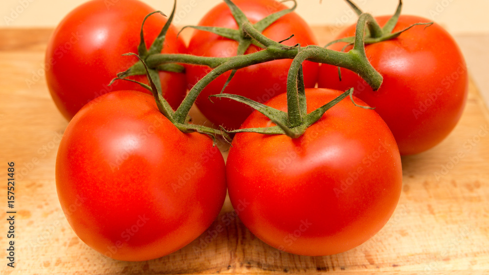 top view of red tomatoes on wooden table top view of red tomatoes on wooden table