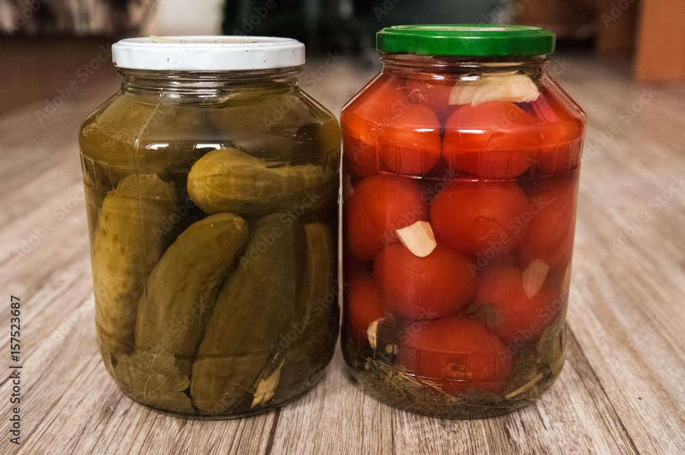 Wrinkled hands. The hands of the elderly man hold things in their hands. Old hands and cans with cucumbers and tomatoes Wrinkled hands. The hands of the elderly man hold things in their hands. Old hands and cans with cucumbers and tomatoes
