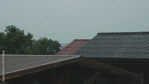 Wallpaper Mural Tropical storm with torrential rain and high winds blowing the roof of the house Torontodigital.ca