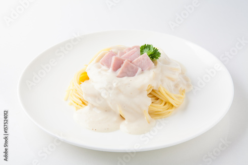 Spaghetti Carbonara with sauce on white plate