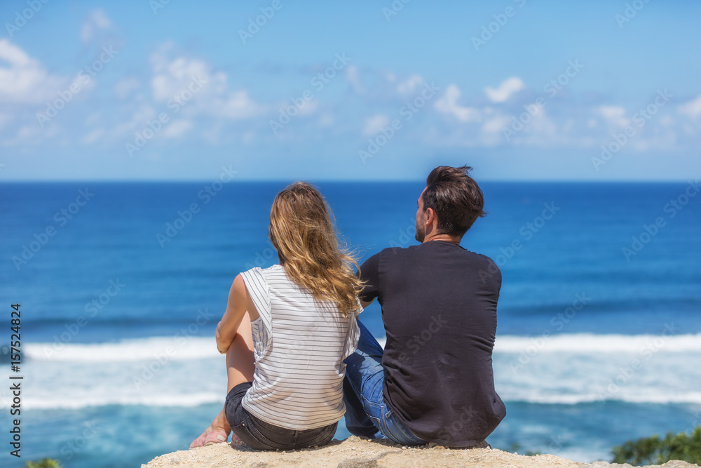 Couple enjoying the view on a tropical beach.