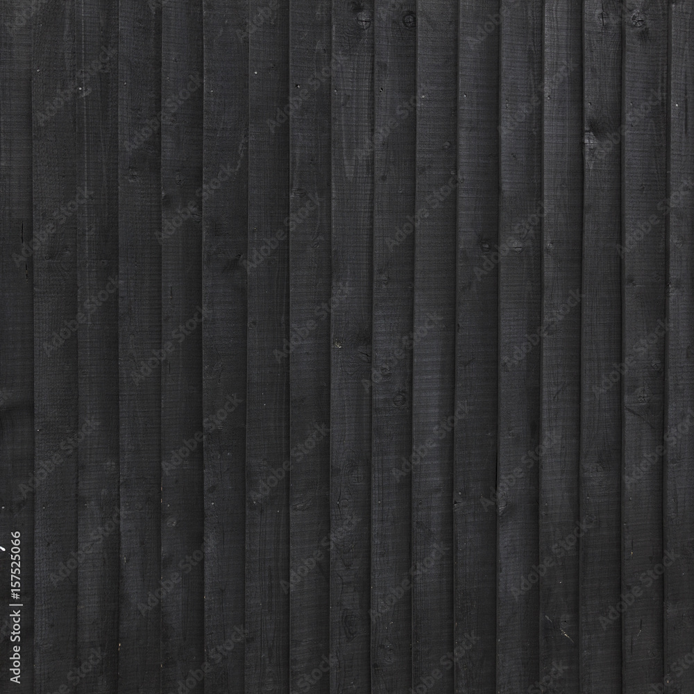 Obraz premium background of black stained vertical planks