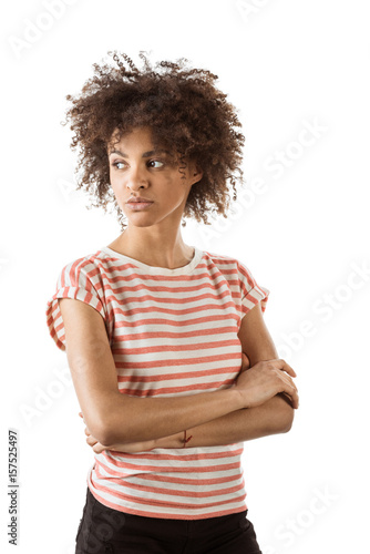 pensive woman with arms crossed looking away isolated on white