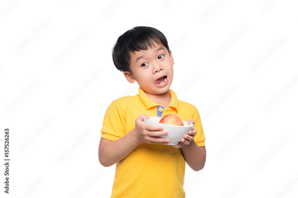 Happy Asian boy holding red apple in bowl. Happy Asian boy holding red apple in bowl.