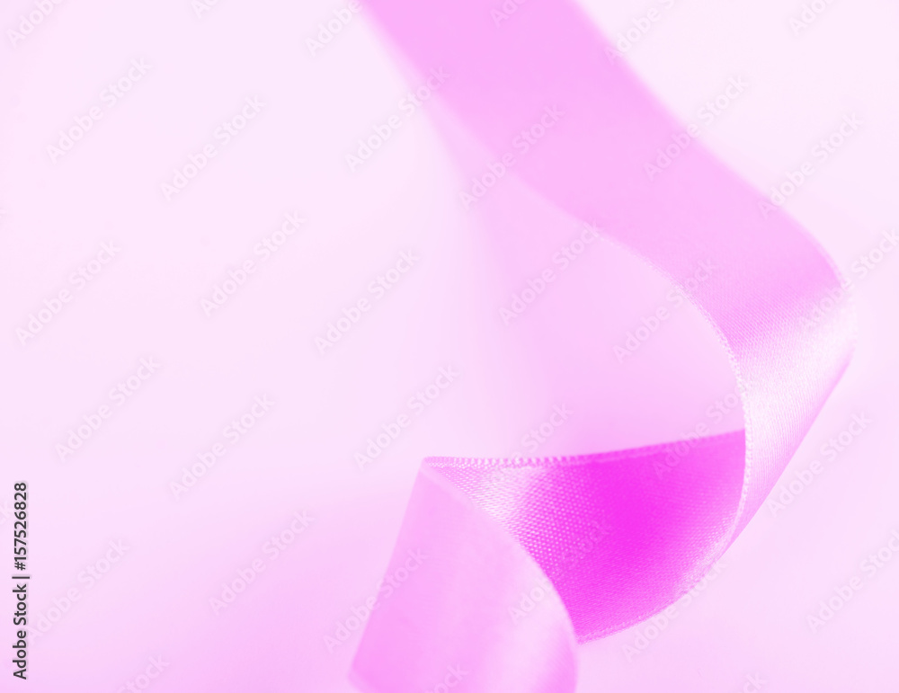 Pink ribbon on white background. Vertical shoot. Isolated. Copy space. Pink ribbon on white background. Vertical shoot. Isolated. Copy space.