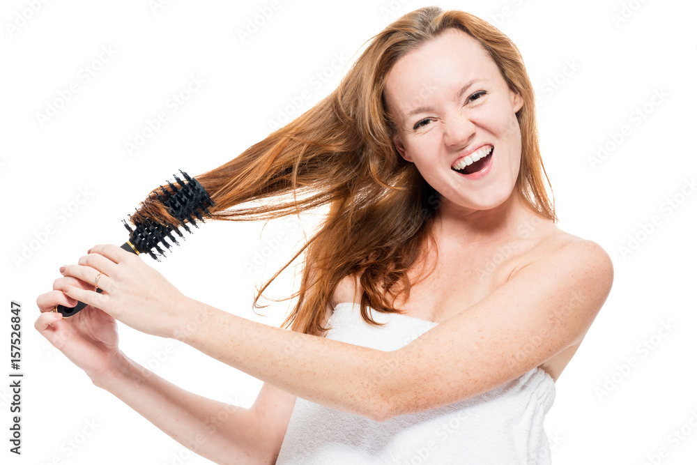 Angry woman combing tangled hair with brush on white background Angry woman combing tangled hair with brush on white background