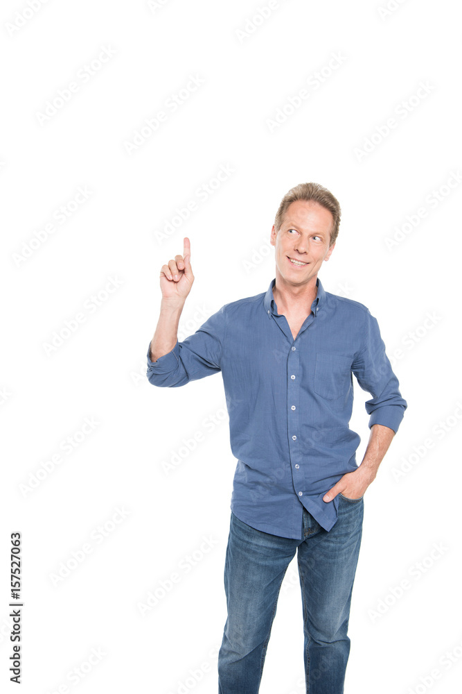 smiling middle aged man pointing up and posing isolated on white smiling middle aged man pointing up and posing isolated on white