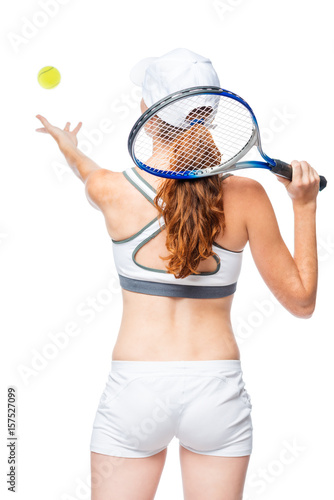 A game of tennis, a woman's back in the frame throws the ball on a white background © kosmos111