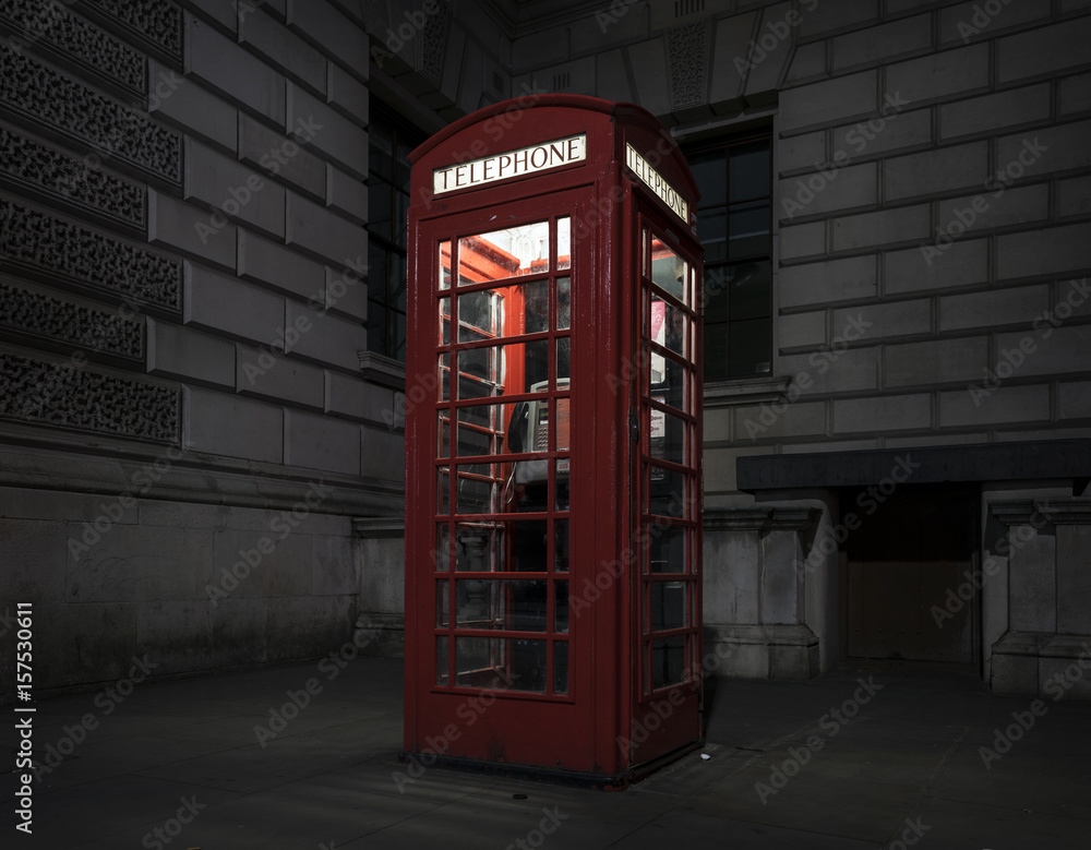old red telephone booth at night in london old red telephone booth at night in london