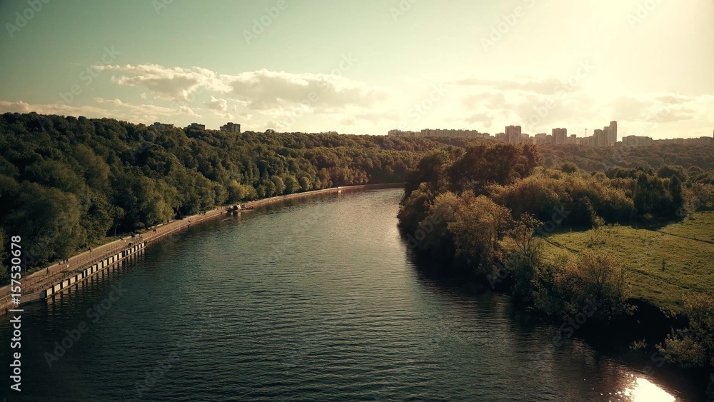 Aerial shot of the Moscow river and Fili park riverside on a sunny day