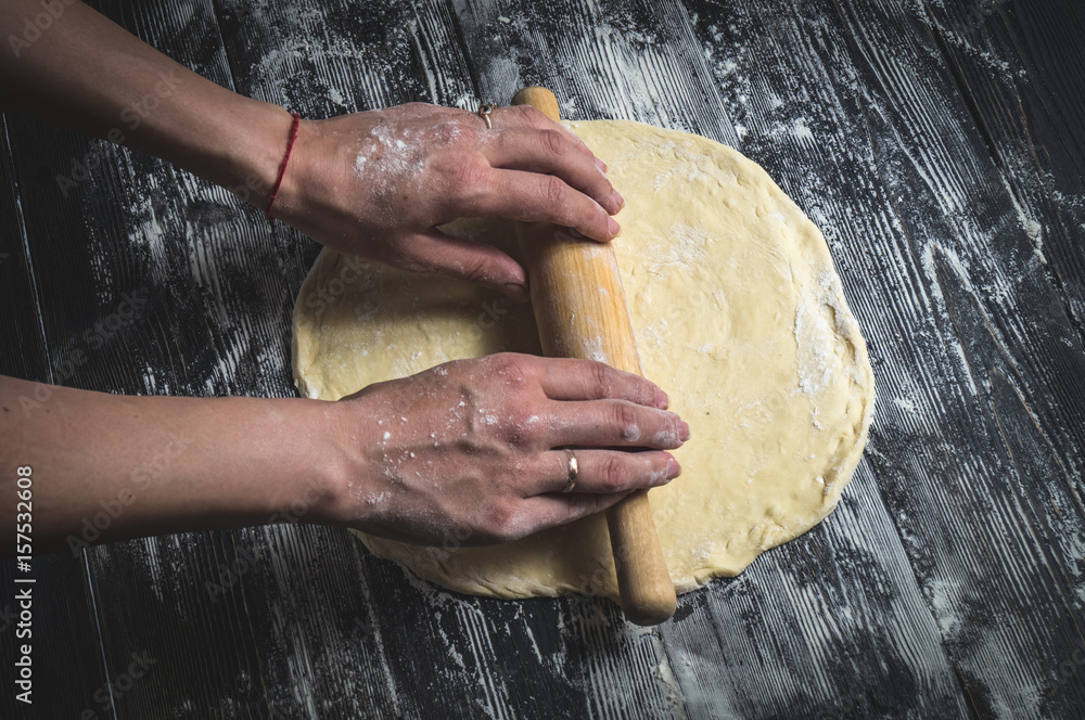 cooking pizza on a wooden table cooking pizza on a wooden table