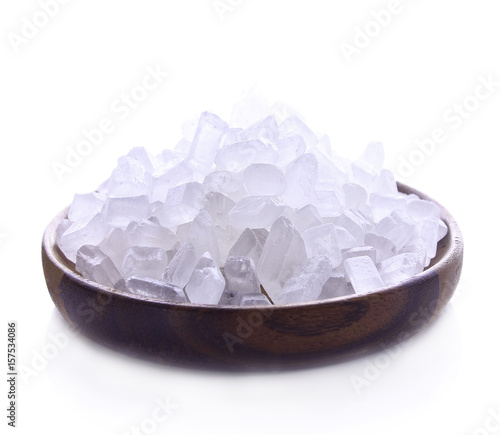 Rock sugar in dish wood on white background