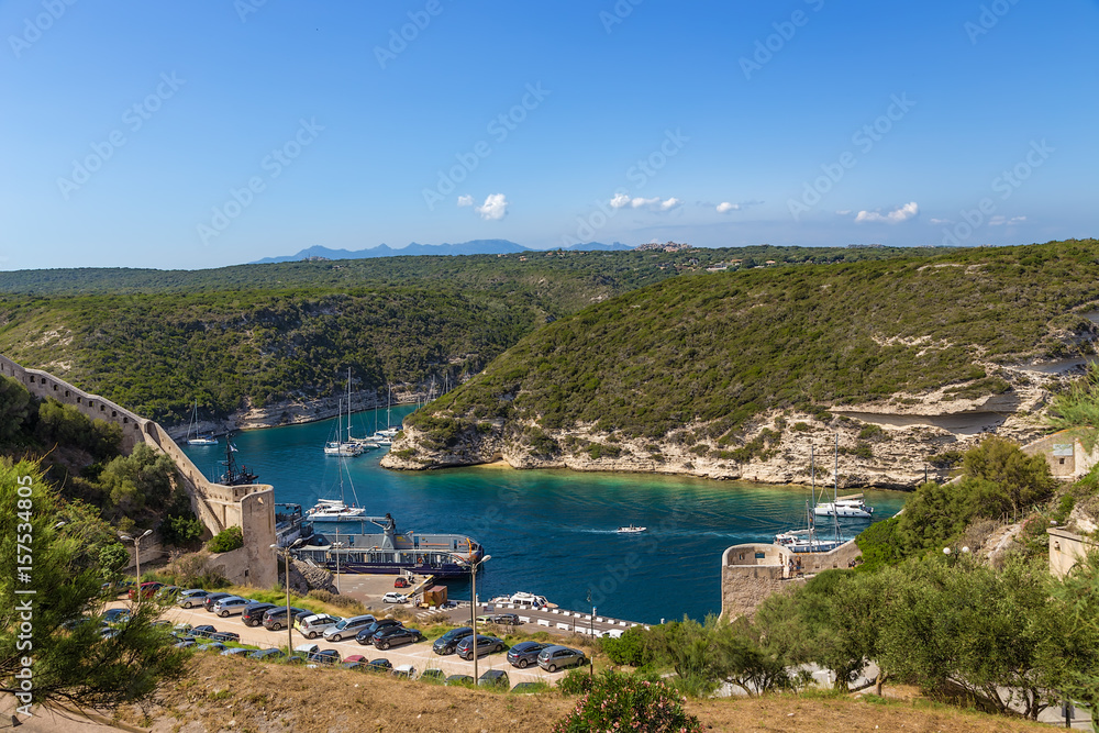 Corsica, France. Bonifacio: a picturesque view of an ancient fortress above the sea bay Corsica, France. Bonifacio: a picturesque view of an ancient fortress above the sea bay