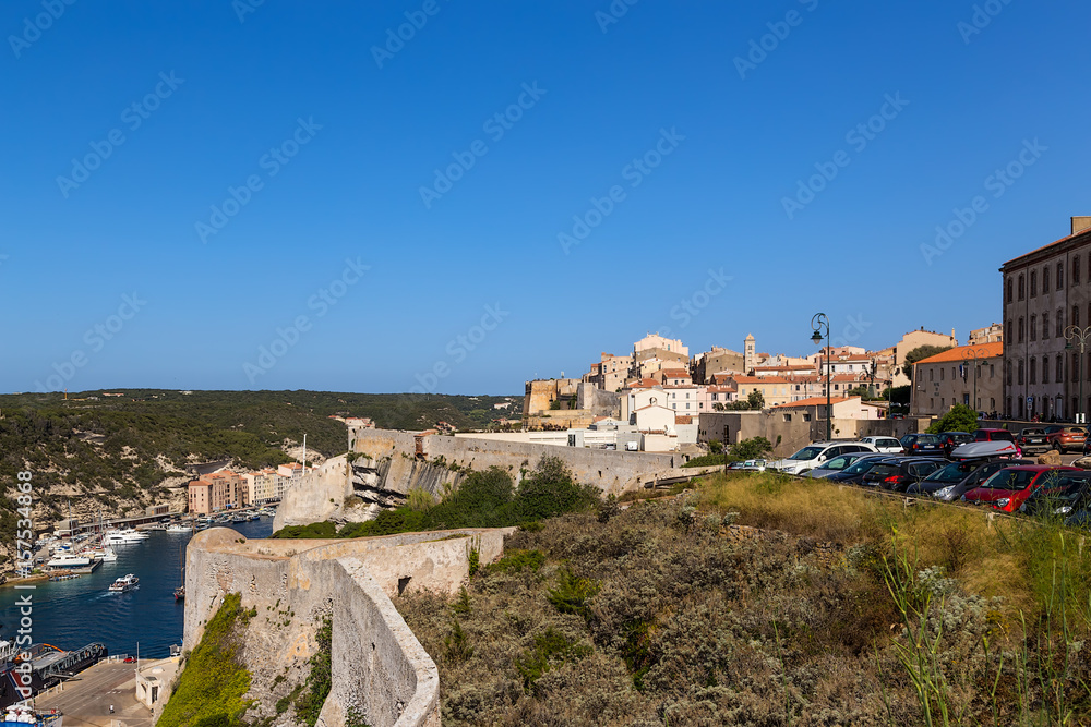 Corsica, France. View of the port in the sea bay and the ancient fortress in Bonifacio