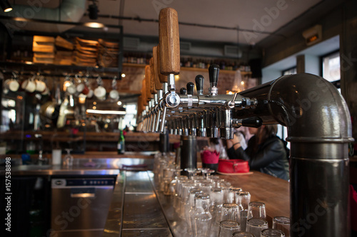 A lot of Golden beer taps at the bar