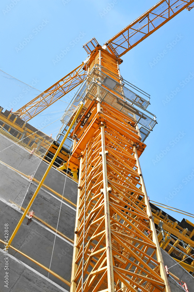 Crane and highrise construction site Crane and highrise construction site