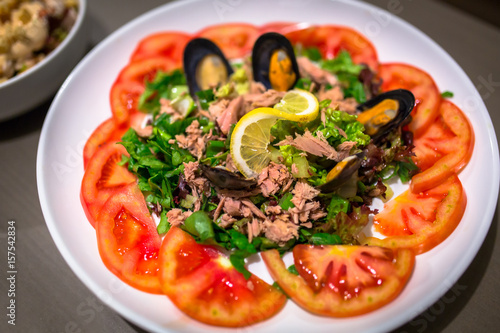 Greek seafood salad on the plate