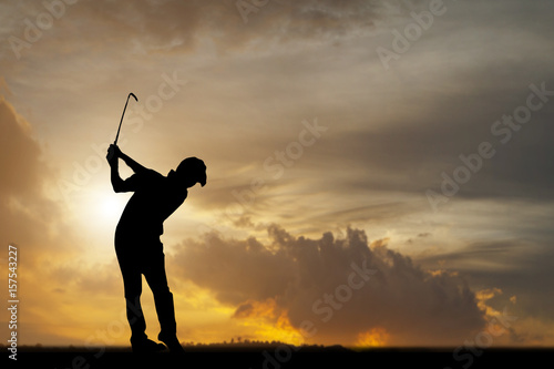 silhouette of golfers hit sweeping and keep golf course in the summer for relax time