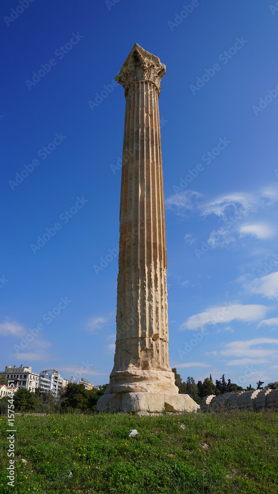 Photo of iconic pillars of Temple of Olympian Zeus with view to the Acropolis and the Parthenon, Athens historic center, Attica, Greece 