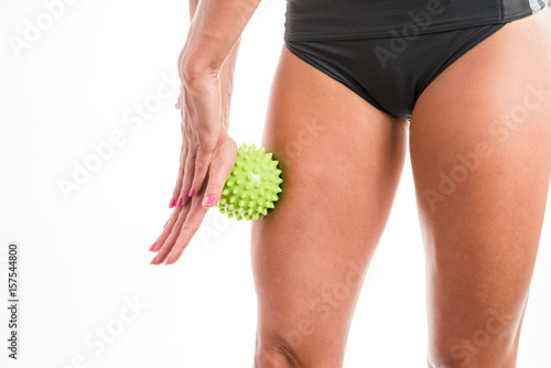 A woman using a massage ball