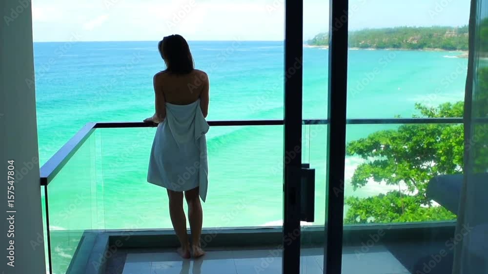 Woman in towel admire exotic view on terrace, super slow motion 120fps
Woman in towel admire exotic view on terrace, super slow motion 120fps