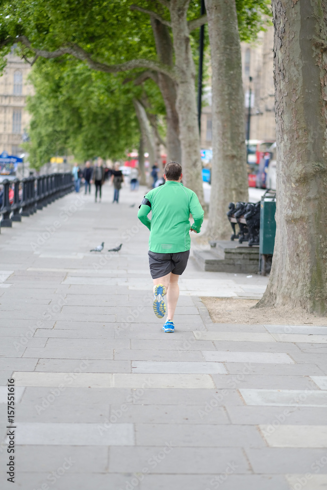 A man is running down London street, Great Britain.