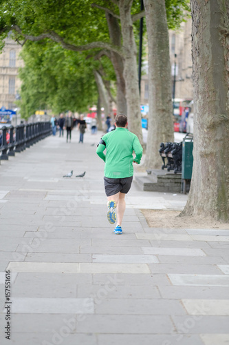 A man is running down London street, Great Britain. © Anna Jurkovska